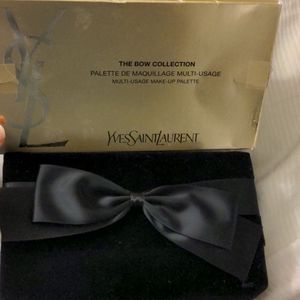 Empty YSL velvet bow box for palette storage.